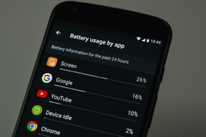 A close-up of an Android phone's screen showing the 'Battery usage by app' settings page, used to find apps that drain the battery.