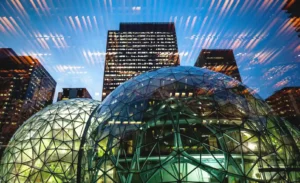 The iconic Spheres at Amazon's headquarters in Seattle, Washington, with the glass dome structures reflecting the surrounding city buildings.